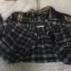 Two heavy flannel shirts.